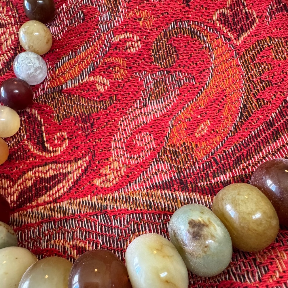 About 9” long with beautiful natural stone beads .